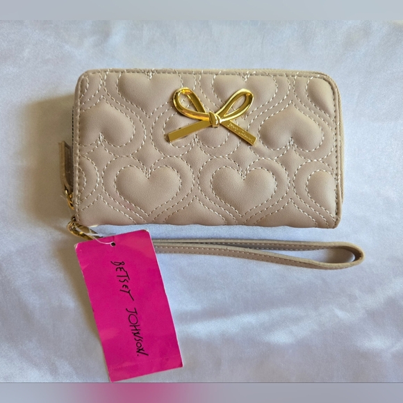 Betsey Johnson Handbags - Betsey Johnson Tan Heart Quilted Wristlet with Gold Bow